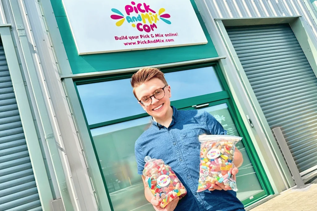 William Hale Outside PickandMix.com Holding Bags of Sweets